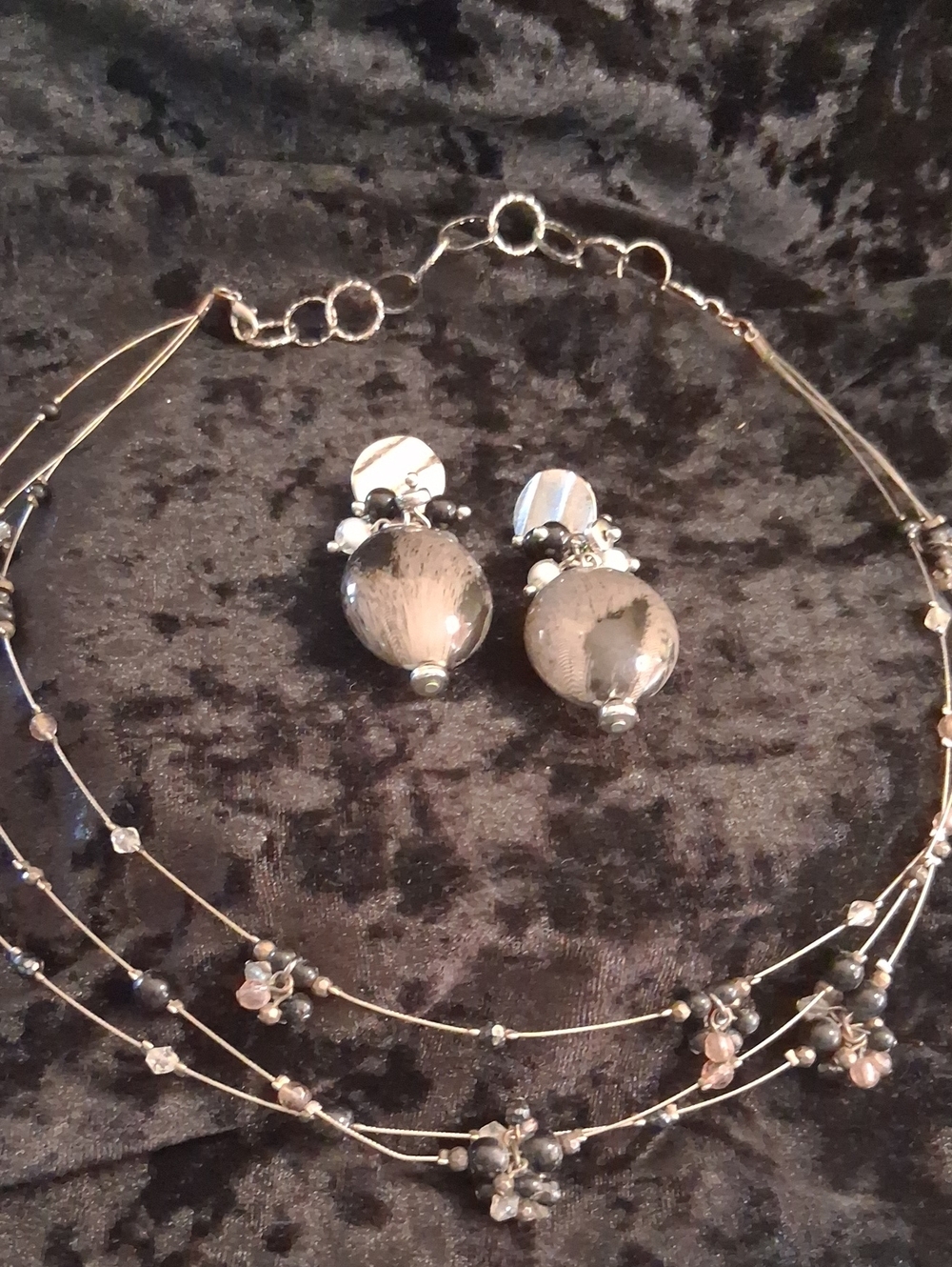 Elegant Multi-Strand Silver and Gray Beaded Necklace with Matching Earrings.